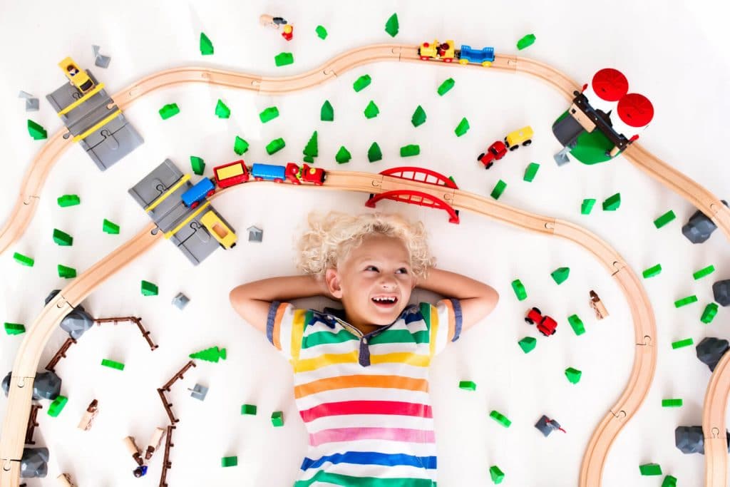 kid playing with train - Arrange according to kid’s interest