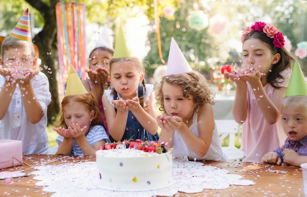 kids blowing - Outdoor kids birthday arrangements